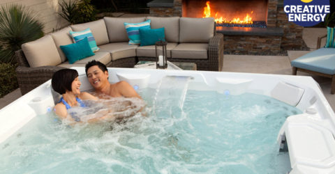 A couple enjoying their new 2018 Limelight hot tub.