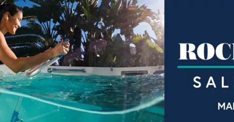 Woman with brown hair in pony tail riding an aquabike in a swim spa: "Rock N' Ride Sales Event"