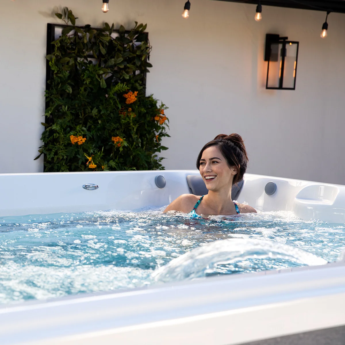 A woman relaxing in an Endless Pools RecSport swim spa 