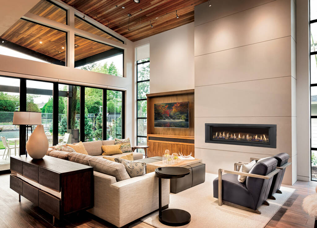 A linear gas fireplace in a large room with high ceilings