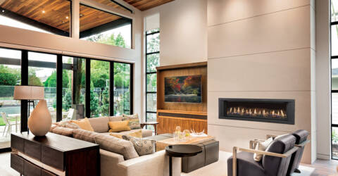 A linear gas fireplace in a large room with high ceilings