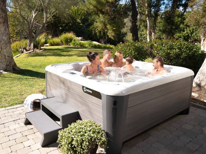 People enjoying Hot Spring Highlife 2020 Vanguard Alpine Hot Tub