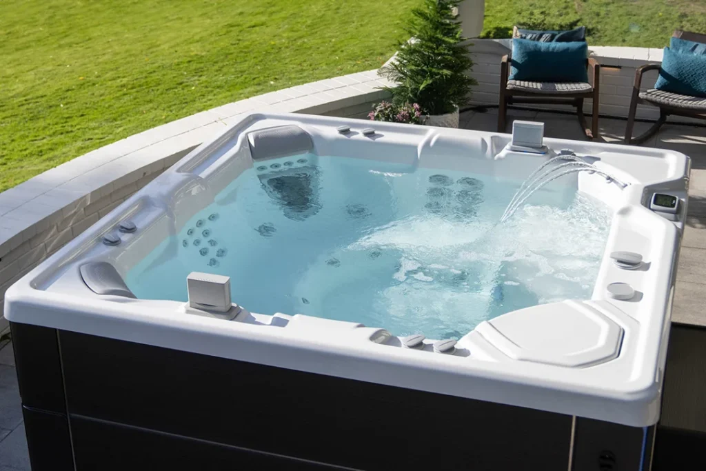 A Hot Springs Highlife hot tub with a FreshWater IQ smart hot tub water monitoring system