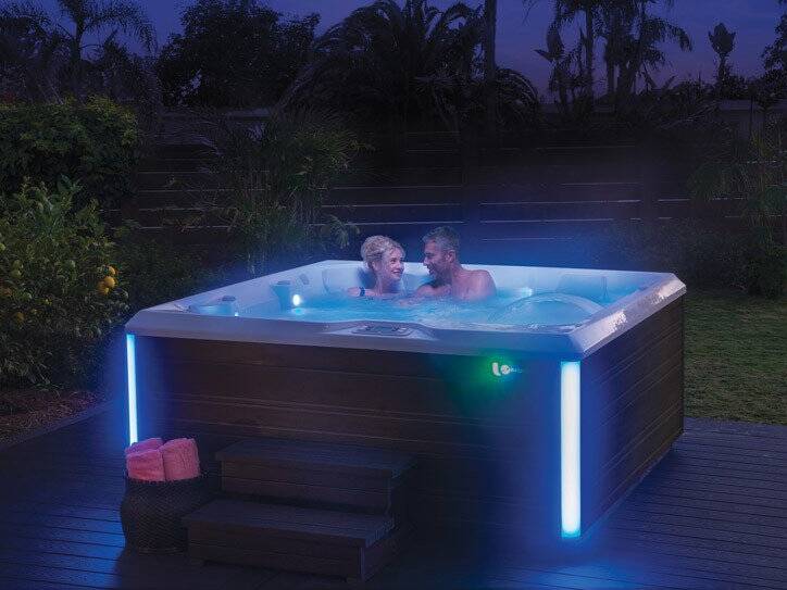 Couple enjoying their Hot Spring Limelight Hot Tub